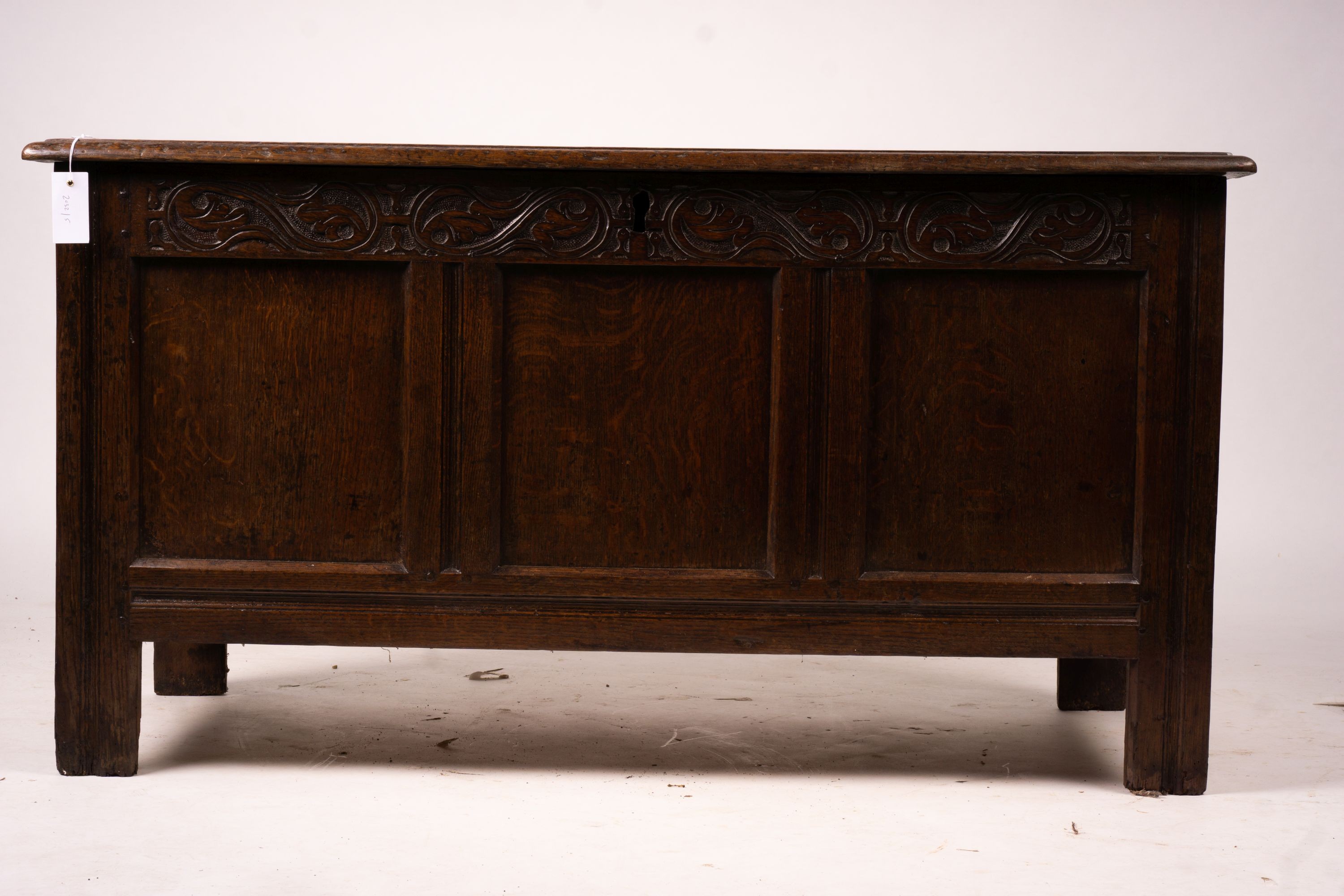 A 17th century panelled oak coffer, W.122cm D.55cm H.65cm